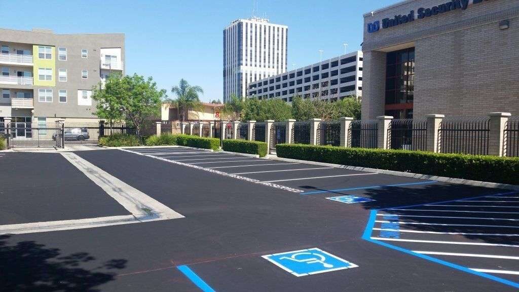 Accessible stalls striped in blue on a fresh lot.