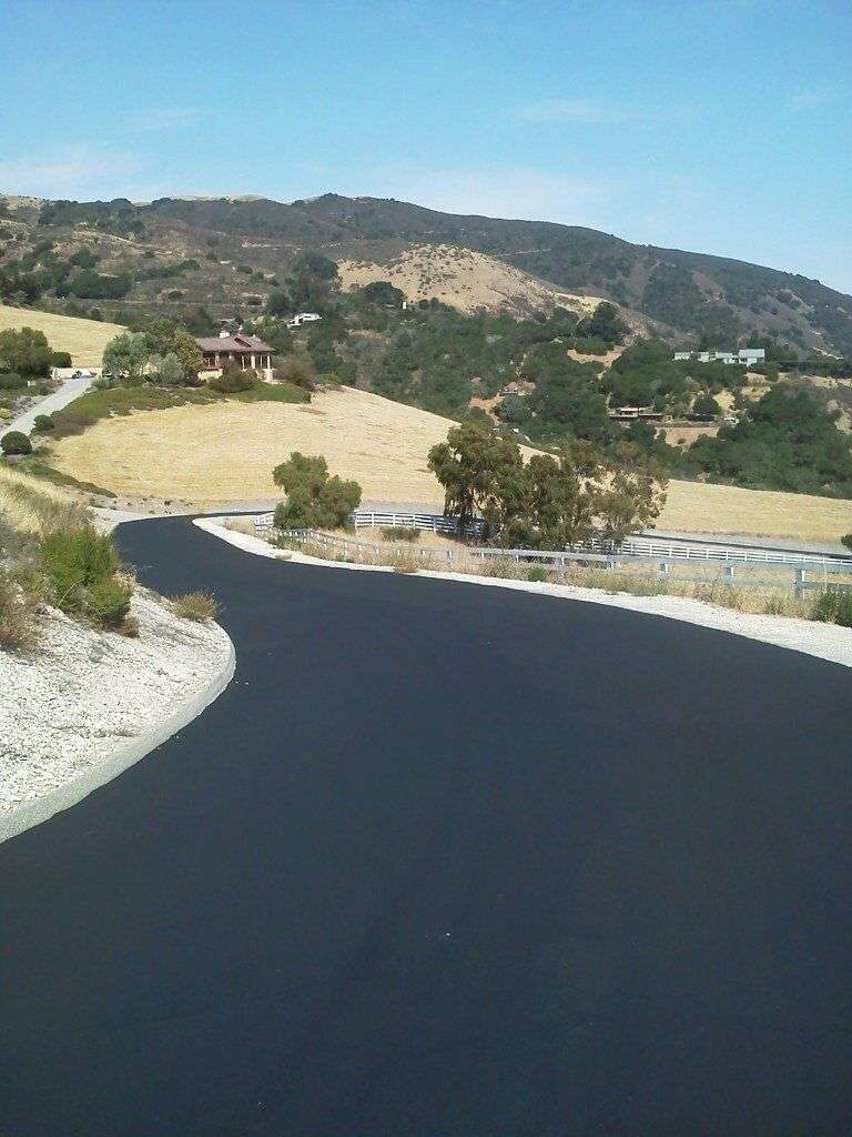 Finished hillside road, freshly paved.